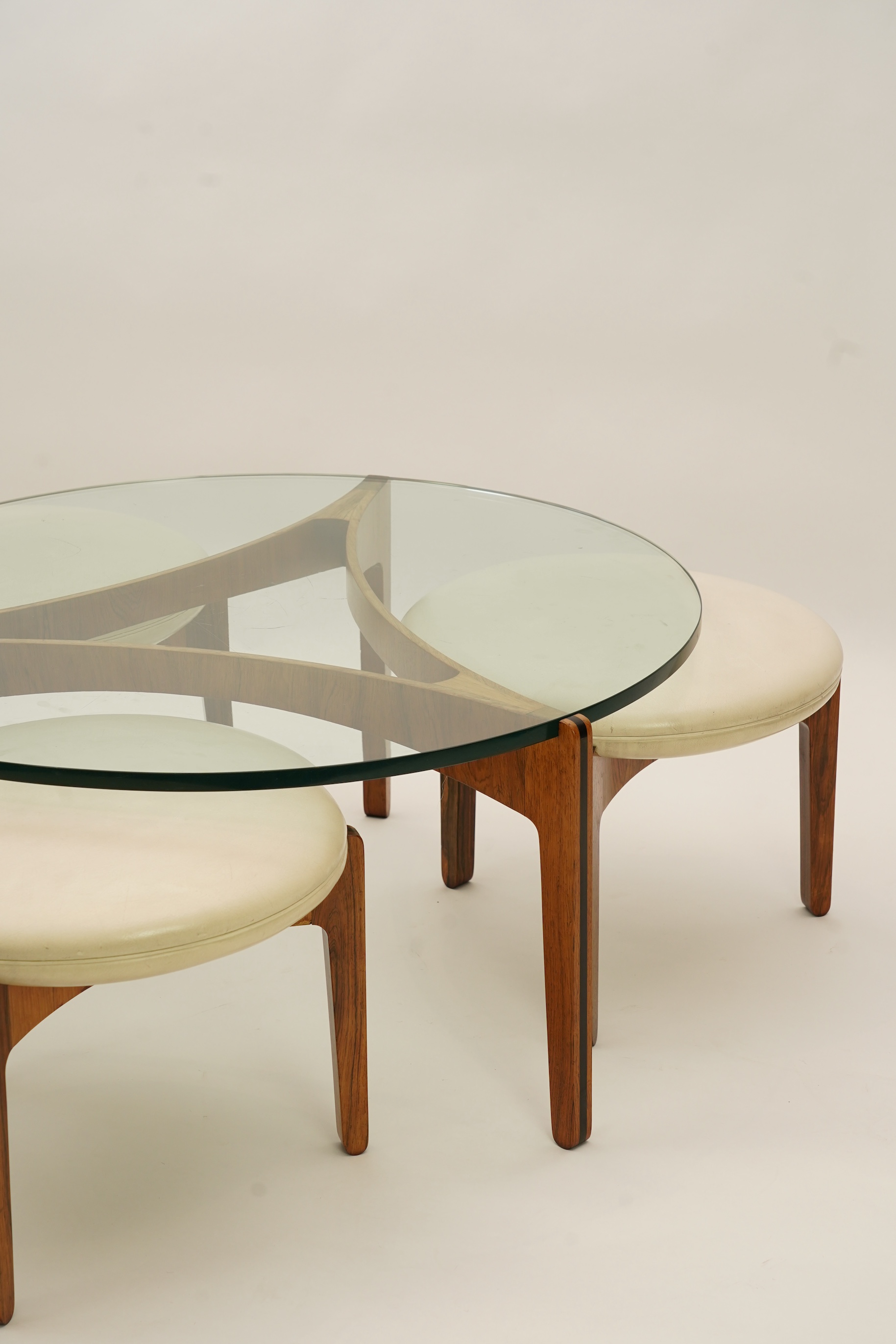 Sven Ellekaer (Danish, 1926-1984) for Christian Linneberg Møbelfabrik: A coffee table and three nesting stools ensuite